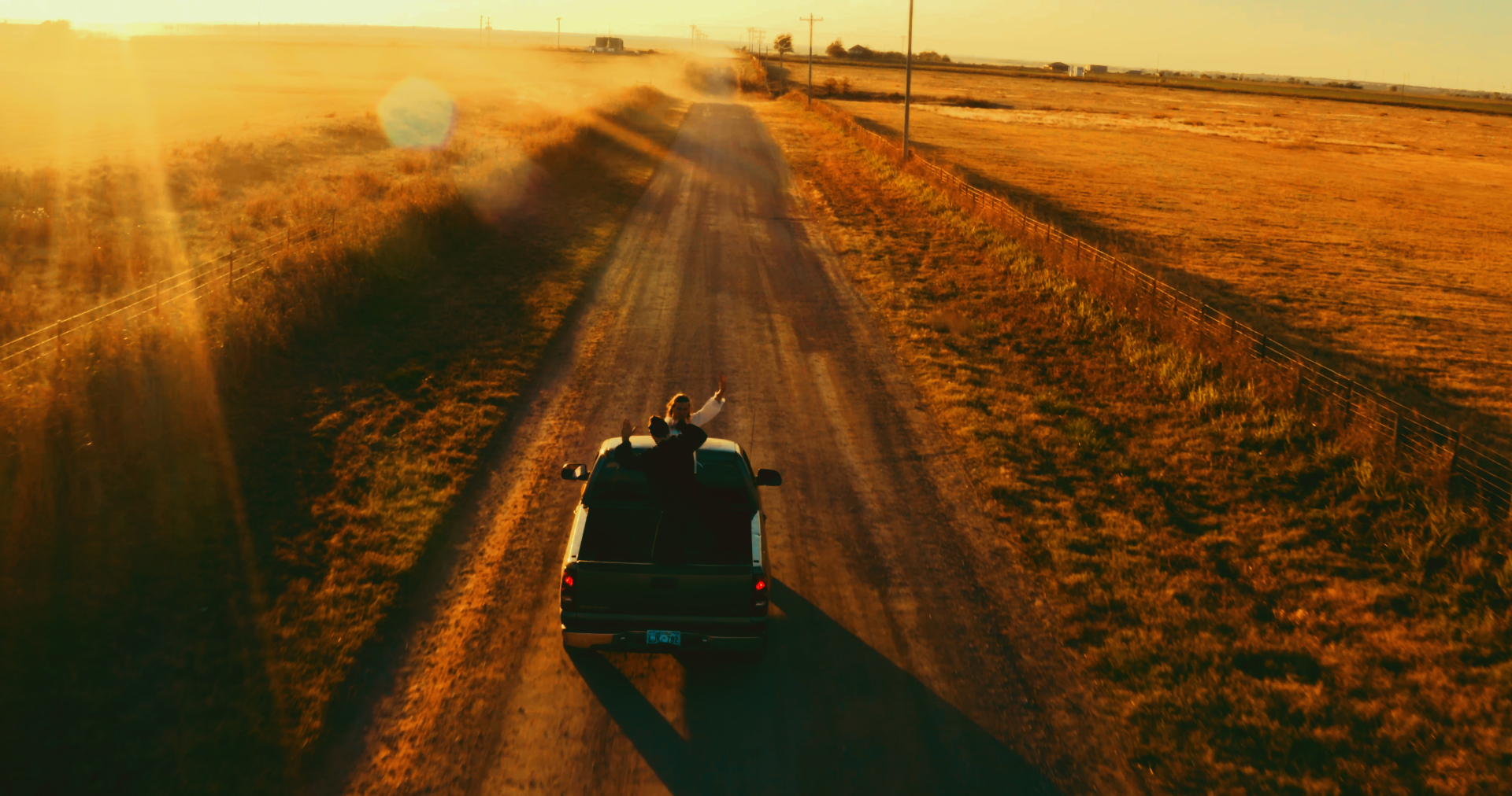 Golden Hour — Dust trail at sundown